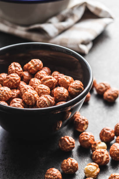 Hazelnuts with sugar icing in bowl.