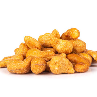 Cashew nuts isolated on white background pile.